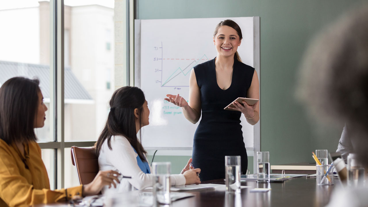 A female corporate professional having a presentation